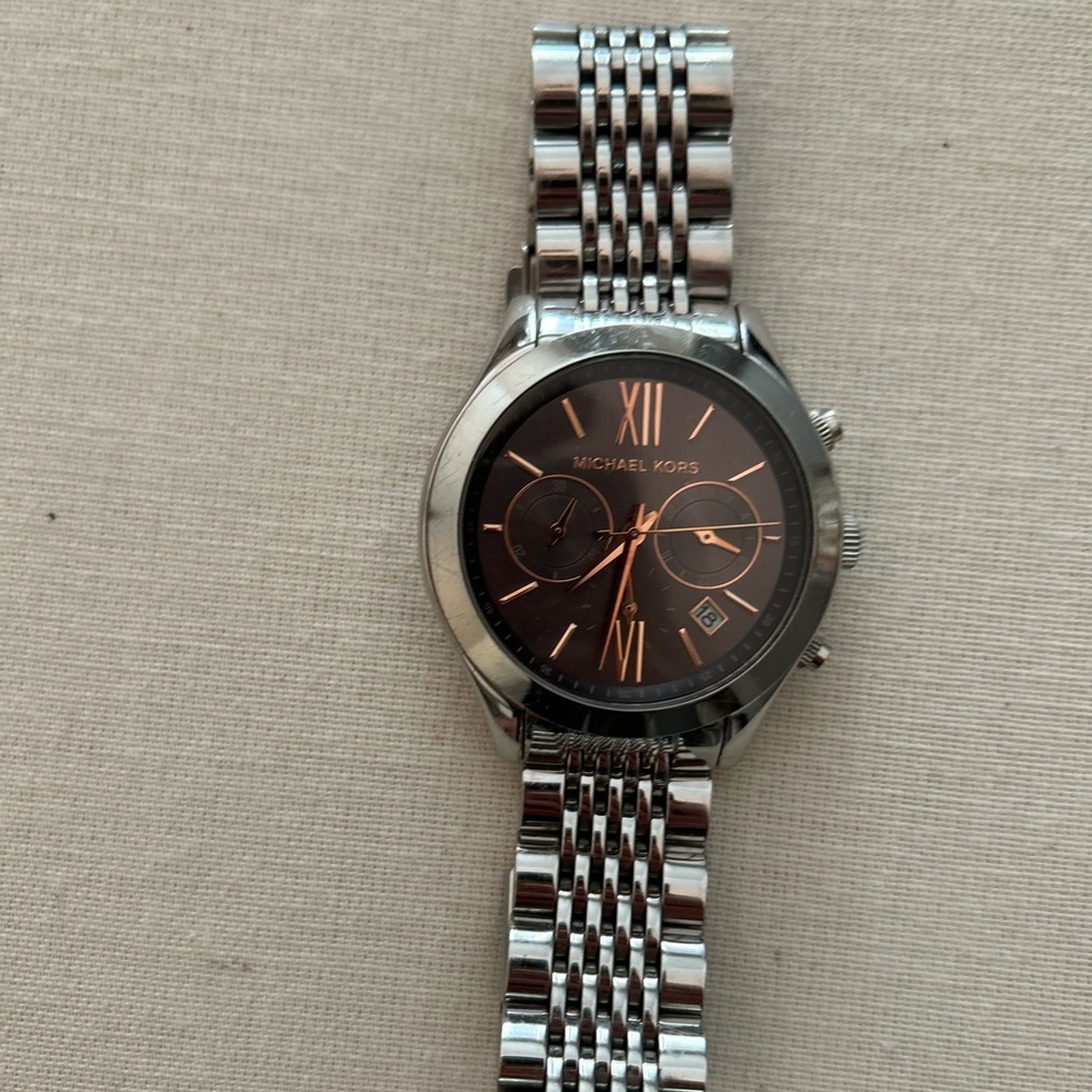 Michael Kors silver tone watch with rose gold markers. Plus extra links .